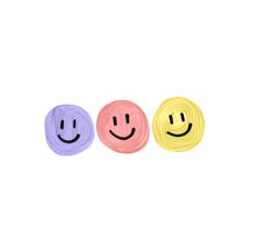 three smiley faces painted in different colors