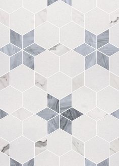 a white and grey marble mosaic tile pattern with hexagons in the middle