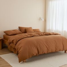 the bed is made up and ready for someone to use it in their home or office