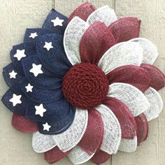 a patriotic wreath hanging on the front door