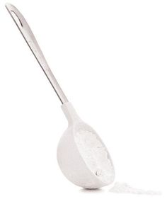 a spoon that is sitting on top of a white surface with a shadow coming from it