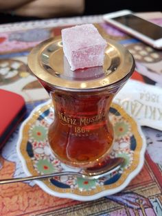 there is a small piece of sugar on top of a tea cup