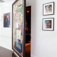 a hallway with pictures on the wall