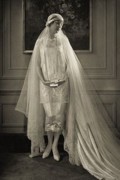 an old photo of a woman wearing a veil