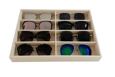 six pairs of sunglasses in a box with mirrored lenses on the top and bottom half