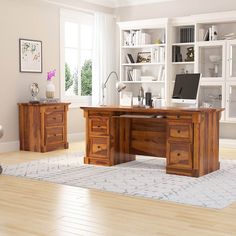 a wooden desk sitting on top of a hard wood floor next to a book shelf