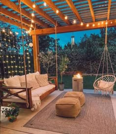 an outdoor living area with swings and lights