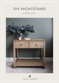 a wooden table with two drawers next to a potted plant on top of it