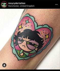 a cartoon character tattoo on the leg