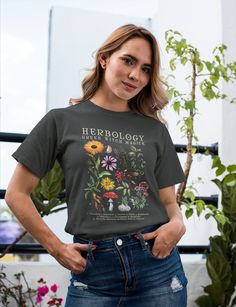 a woman standing with her hands on her hips wearing a t - shirt that says herbology is the answer