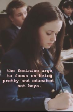 a girl is writing in her class room with two other boys behind her and the caption reads, the feminine urge to focus on being pretty and educated not boys