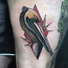 a close up of a person's leg with a bird on it