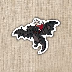 a sticker with an image of a woman riding a bat on it's back