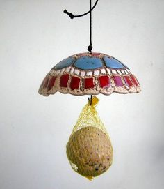 a lamp hanging from a string with a bag on it