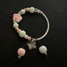 In oriental culture, peach flowers are considered as love charms which might bring luck to your romantic love life and relationships. These bracelets were made with all natural materials: ceramics and metal. The pink flower shaped ceramic piece along with other glazed ceramic beads and silver metallic spacing beads, were threaded through a stretchy band. These bracelets look exquisite, delicate and charming. May this beautiful love charm bring you happiness and joy! Peach Blossom, Peach Flowers, Peach Blossoms, Love Charms, Ceramic Beads, Romantic Love, Glazed Ceramic, Beautiful Love, Flower Shape