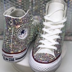 **Custom Bling Converse High Tops By Bookerzbling** Step Up Your Style With These Custom Shoes Expertly Designed To Add A Touch Of Sparkle To Every Step! Each Pair Features High-Quality **Ab Rhinestones**, Which Beautifully Reflect A Spectrum Of Colorsclear, Yellow, Pink, Silver, Green, And Moredepending On The Lighting And Angle. Key Details: - Authentic **White Converse High Tops** - **Ab Rhinestones** For A Dazzling, Multi-Color Shine - Outsole May Feature The **Classic Red And Blue Lines** O Bedazzled White Converse, Rhinestones Converse, Bling Converse Shoes, Bedazzled Converse, Sparkly Converse, Rhinestone Converse, Bedazzled Shoes Diy, Blue Quinceanera, White Converse Shoes