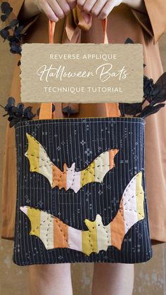 a woman is holding a bat purse made out of fabric and paper with the words reverse applique halloween bats technique