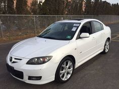 a white car parked in a parking lot