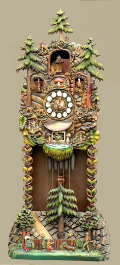 an ornate clock with trees and animals on it