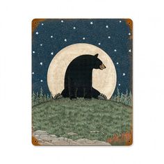 a black bear sitting on top of a lush green field under a full moon with stars