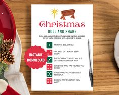 the christmas roll and share game is next to a red plate with pine cones on it