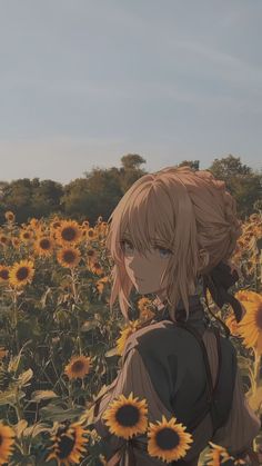 a woman standing in a field of sunflowers