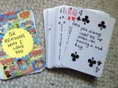 four playing cards that have been written on them