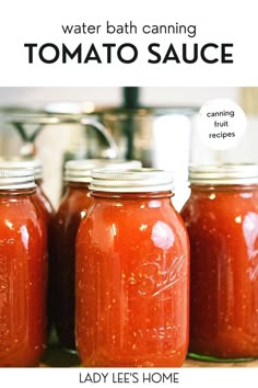 three jars filled with tomato sauce sitting on top of a counter