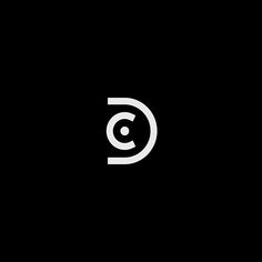 a black and white logo with the letter c in it's center, on a dark background