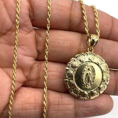 A Beautiful Jewelry That Is Made Of Authentic 100% 10k Karat Real Gold (Color:Yellow Gold ) That Is Not Plated/Filled. It Will Not Tarnish Or Fade Overtime And Will Last You A Lifetime To Enjoy. It Measures 18" Inches Long. Width 1.5 Mm Pendant 1.2 Inches (Back To Back Charm) It Is Stamped 10k For Authenticity. Its Shiny And Unique. Please See All Pictures For Dimensions. It Comes With A Gift Box Available Spiritual Yellow Gold-plated Charm Necklaces, Gold Our Lady Of Guadalupe Medallion Necklace, Gold Our Lady Of Guadalupe Necklace In 14k Gold, Spiritual Yellow Gold Our Lady Of Guadalupe Jewelry, Spiritual Jewelry: Our Lady Of Guadalupe Round Pendant, Charm Pendant Necklace, Yellow Color, 10k Gold, Real Gold