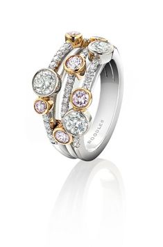 a white and yellow gold ring with diamonds