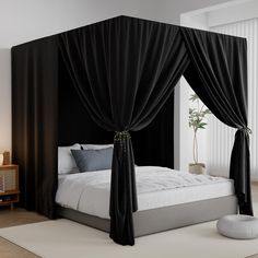 a bed with black drapes and pillows on top of it in a room next to a window