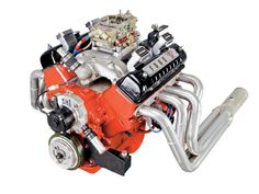 an orange and silver engine on a white background