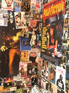 the wall is covered with posters and pictures from various films, including pulp fiction movies