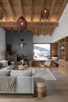 the living room is decorated in wood and gray