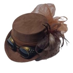 Looking for something to tip your outfit into the epitome of elegance and edginess? We've got just the thing for you, our Fuss and Feathers Top Hat in Brown! Designed to captivate attention and exude sophistication, this feminine top hat is a must-have accessory for those seeking to make a bold fashion statement. Its classic top hat silhouette is infused with modern flair, thanks to the addition of attached goggles that lend an adventurous steampunk vibe. Constructed from high-quality materials, Steam Punk Hats Woman, Steampunk Hats Women, Steam Punk Accessories, Modern Steampunk Fashion, Mens Skeleton Costume, Dream Costume, Hat Silhouette, Punk Clothes, White Cowboy Hat