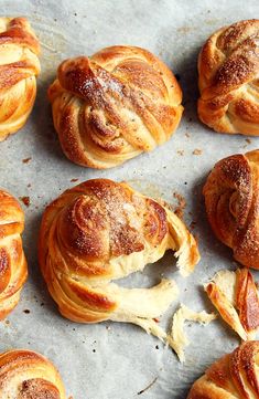 freshly baked pastries sitting on top of a baking sheet