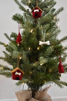 a small christmas tree with ornaments on it