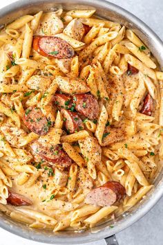 a pan filled with pasta and sausage