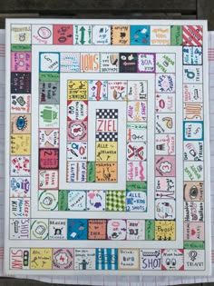 a colorful game board with lots of stickers on it