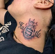 a woman with a tattoo on her neck