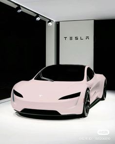 a pink car is parked in front of a black and white wall with the tesla logo on it