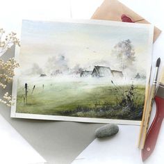 a watercolor painting of a farm scene with flowers and scissors on the table next to it