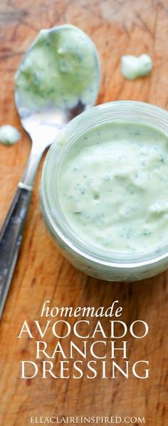 homemade avocado ranch dressing in a glass bowl with spoons on the side