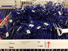 a pile of blue scissors sitting on top of a shelf