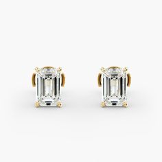 Channel timeless elegance as you add sparkle to your style with these stud earrings featuring  emerald-cut diamonds. The 18k yellow gold setting completes the look with luxurious lustre. Emerald Cut Diamond, Yellow Gold Setting, Diamond Stud Earrings, Emerald Cut Diamonds, Diamond Stud, Anniversary Sale, Gold Set, Diamond Earrings Studs, Diamond Studs