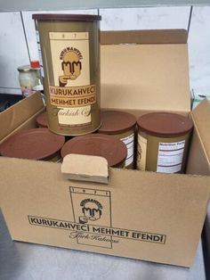 an open cardboard box filled with different types of condiments and seasoning powder