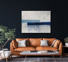 a living room scene with focus on the couch and coffee table