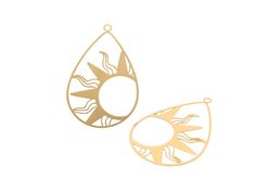 two gold earrings with sun and moon designs on them