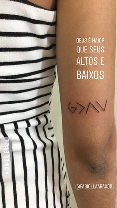 a woman with a tattoo on her arm that reads, deus e mair que seis altos e baxos